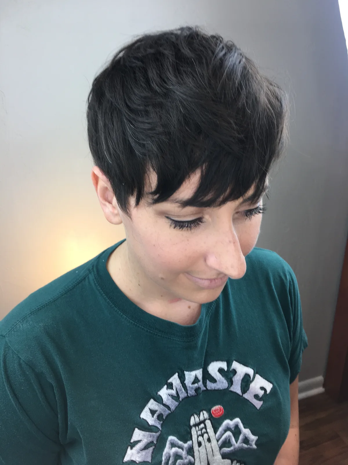 Long pixie cut with a soft fringe on dark hair