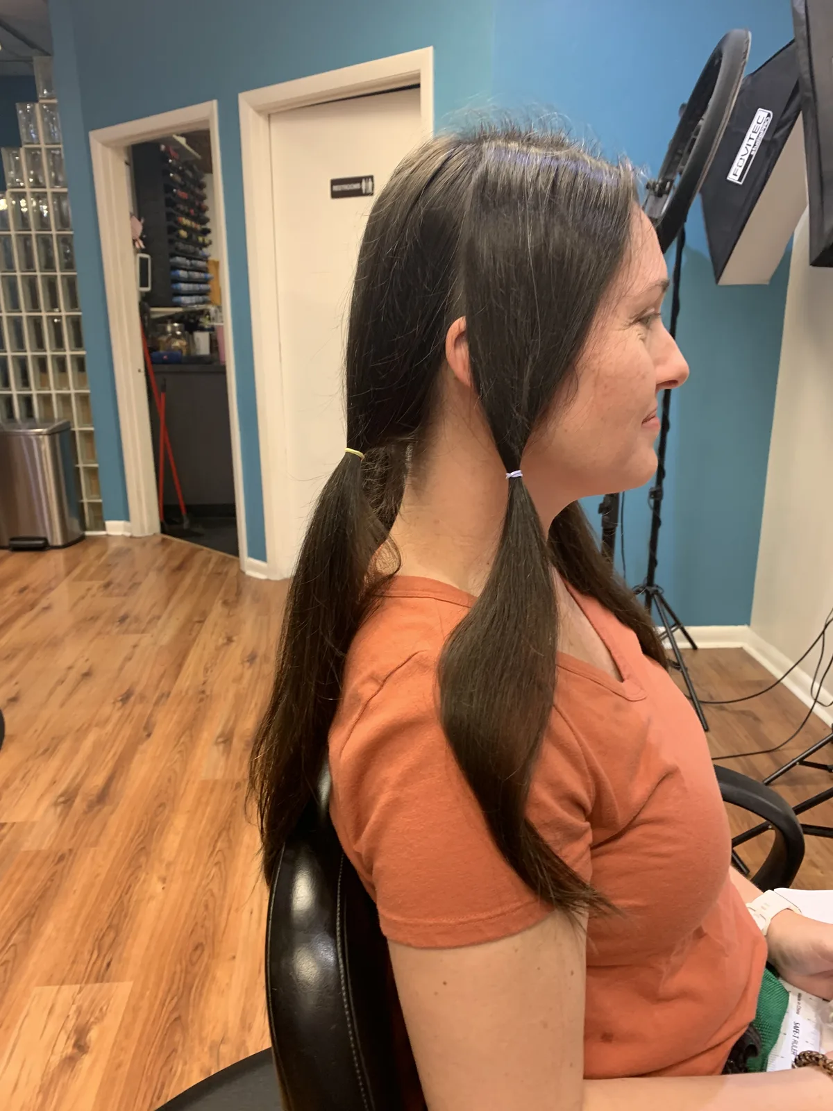 Before the big chop: long hair sectioned into ponytails for donation