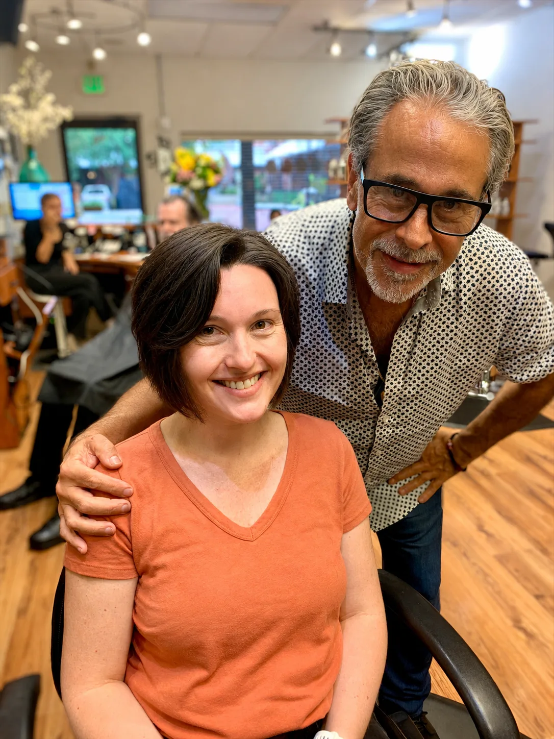 After the big chop: a soft short bob, with Michele Anzivino beside his guest