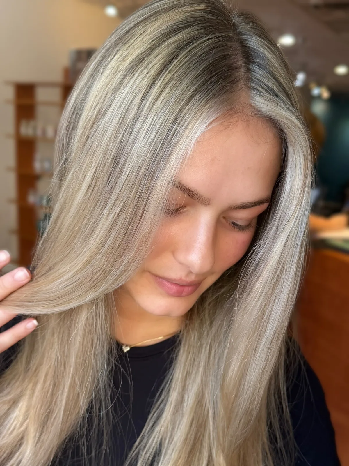 Cool ash blonde highlights with soft dimension, close up