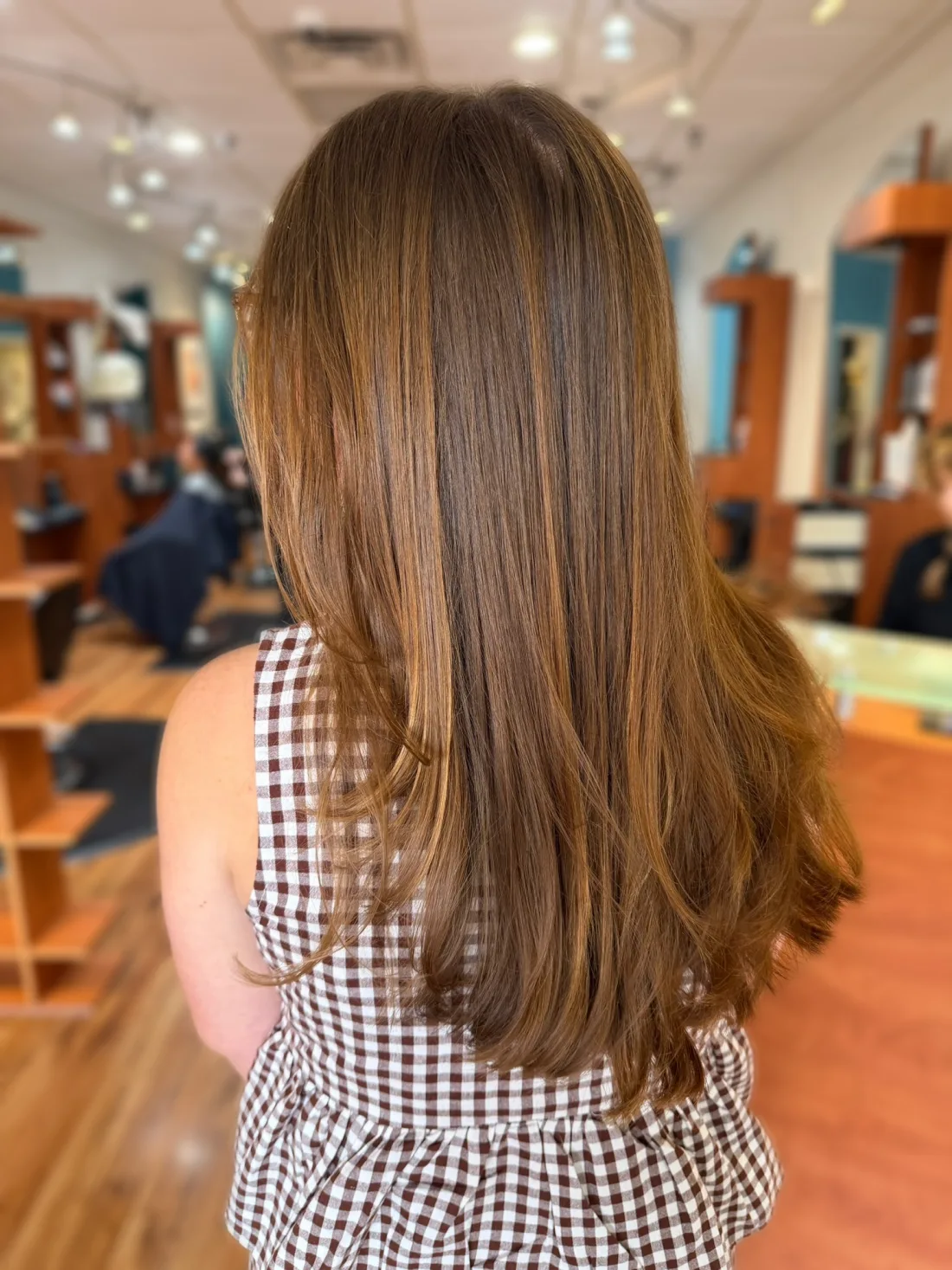 Warm caramel brunette balayage in soft layers