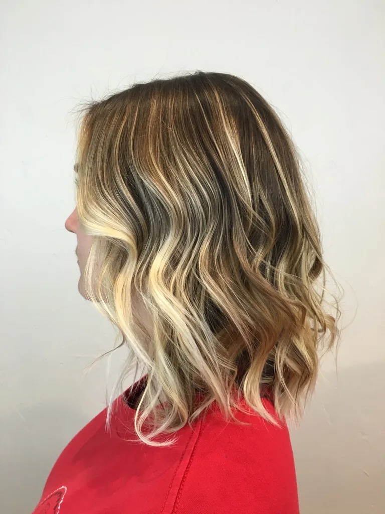 Dark roots melting into caramel balayage ends