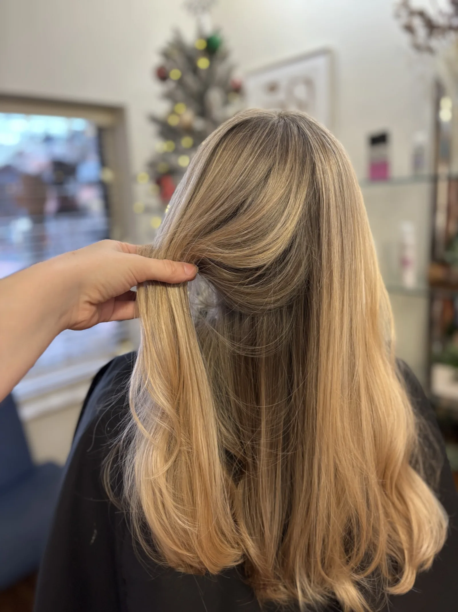 Evened-out blonde with soft dimension after a color correction at Ciao Bella Salon