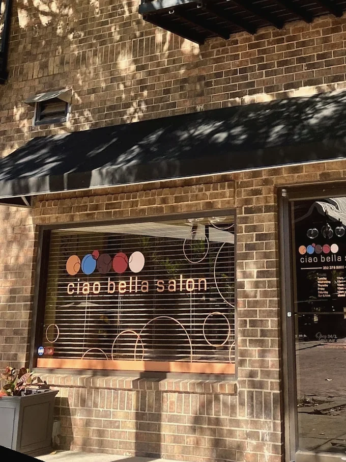 The Ciao Bella Salon storefront with black awnings on South Main Street, Downtown Gainesville